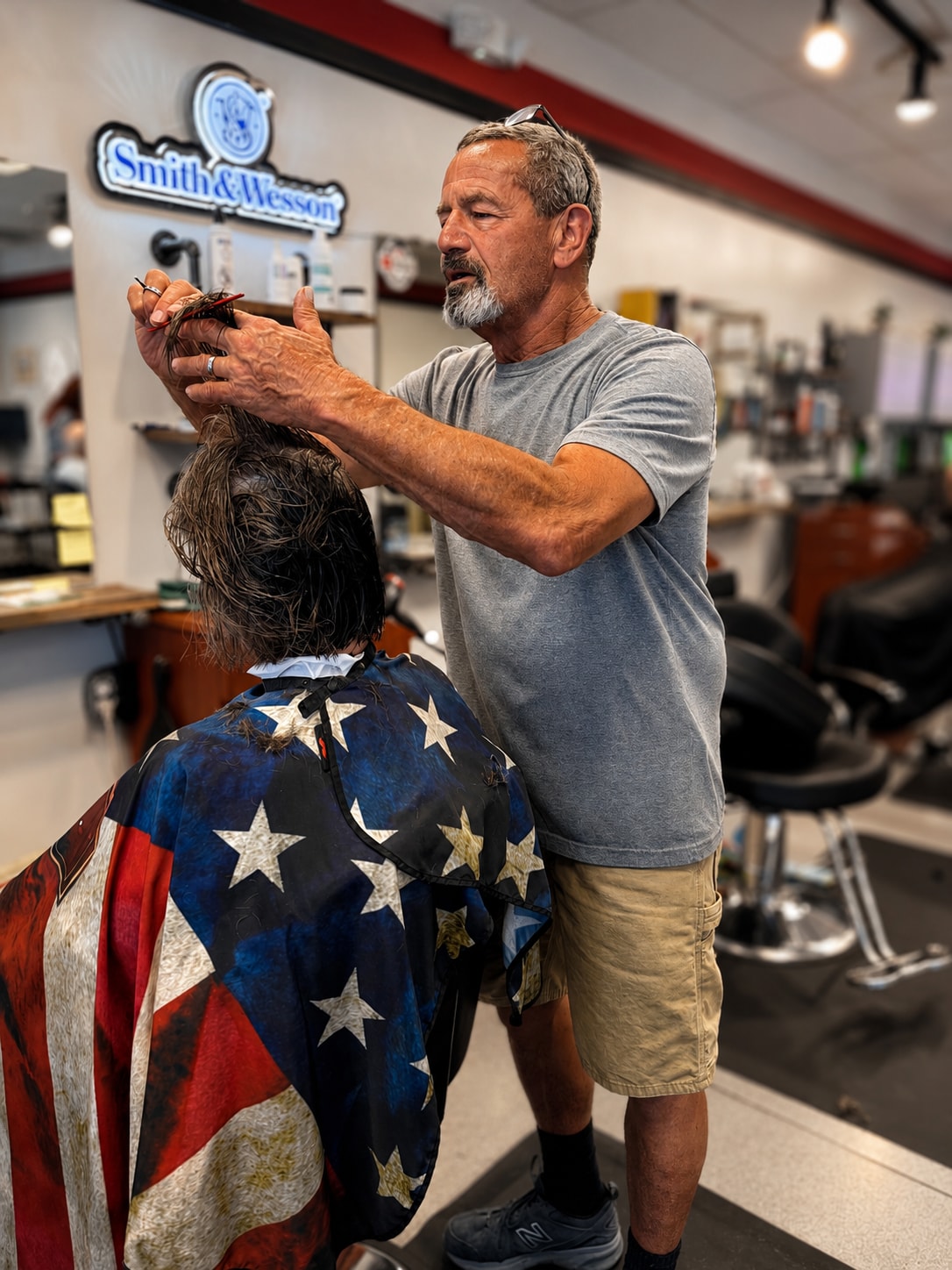 The owner giving a client a fresh haircut at TeamClips